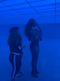 two women standing in a blue pool